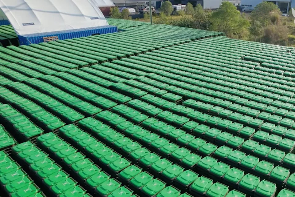Hundreds of FOGO bins in a depot. 
