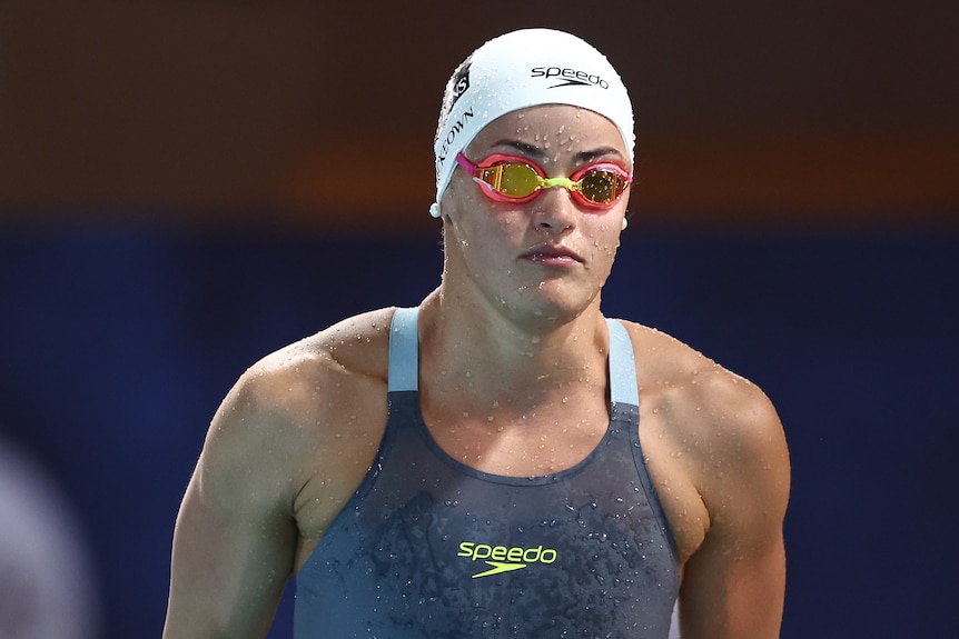 Kaylee McKeown stands behind the blocks