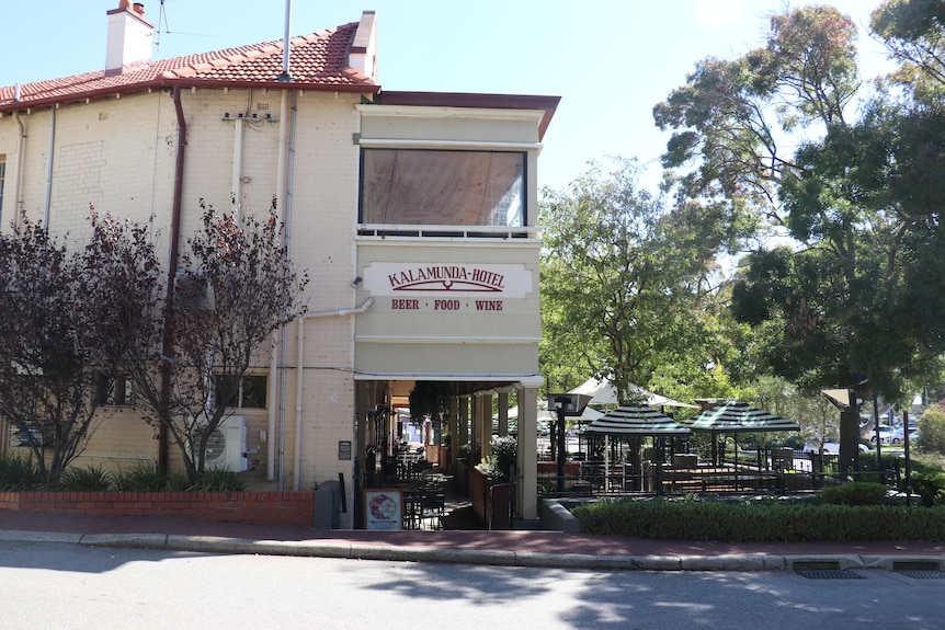 An older pub building in a suburban street
