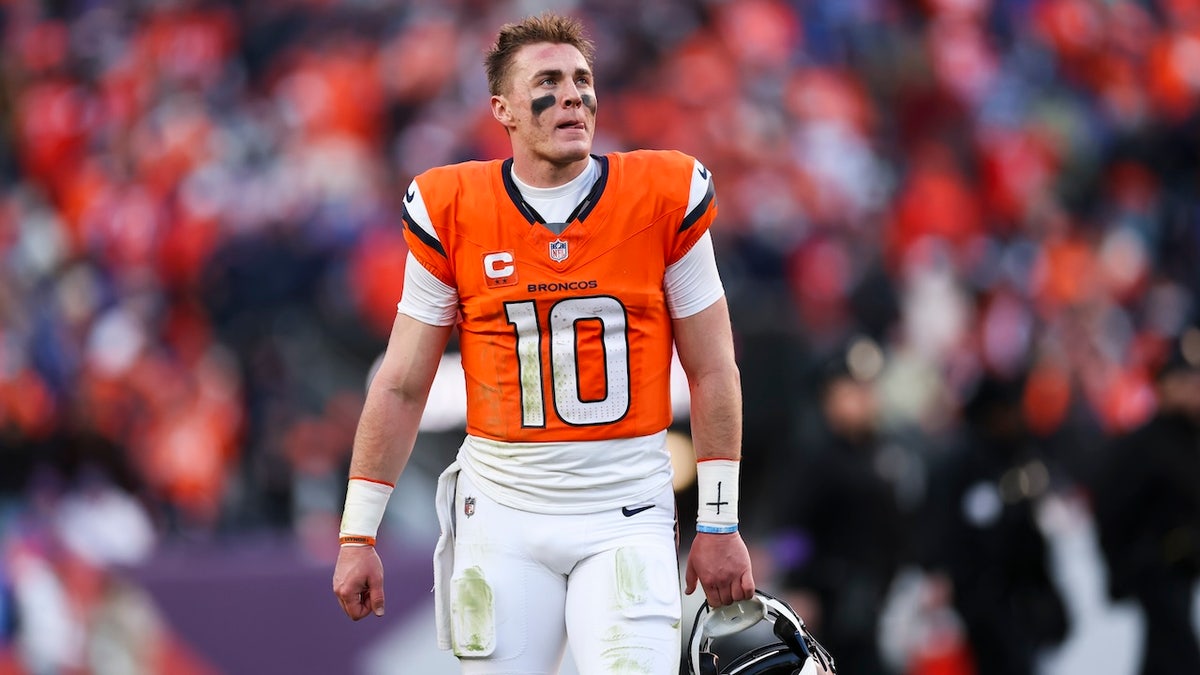 Bo Nix of the Denver Broncos looking on during halftime at Empower Field At Mile High