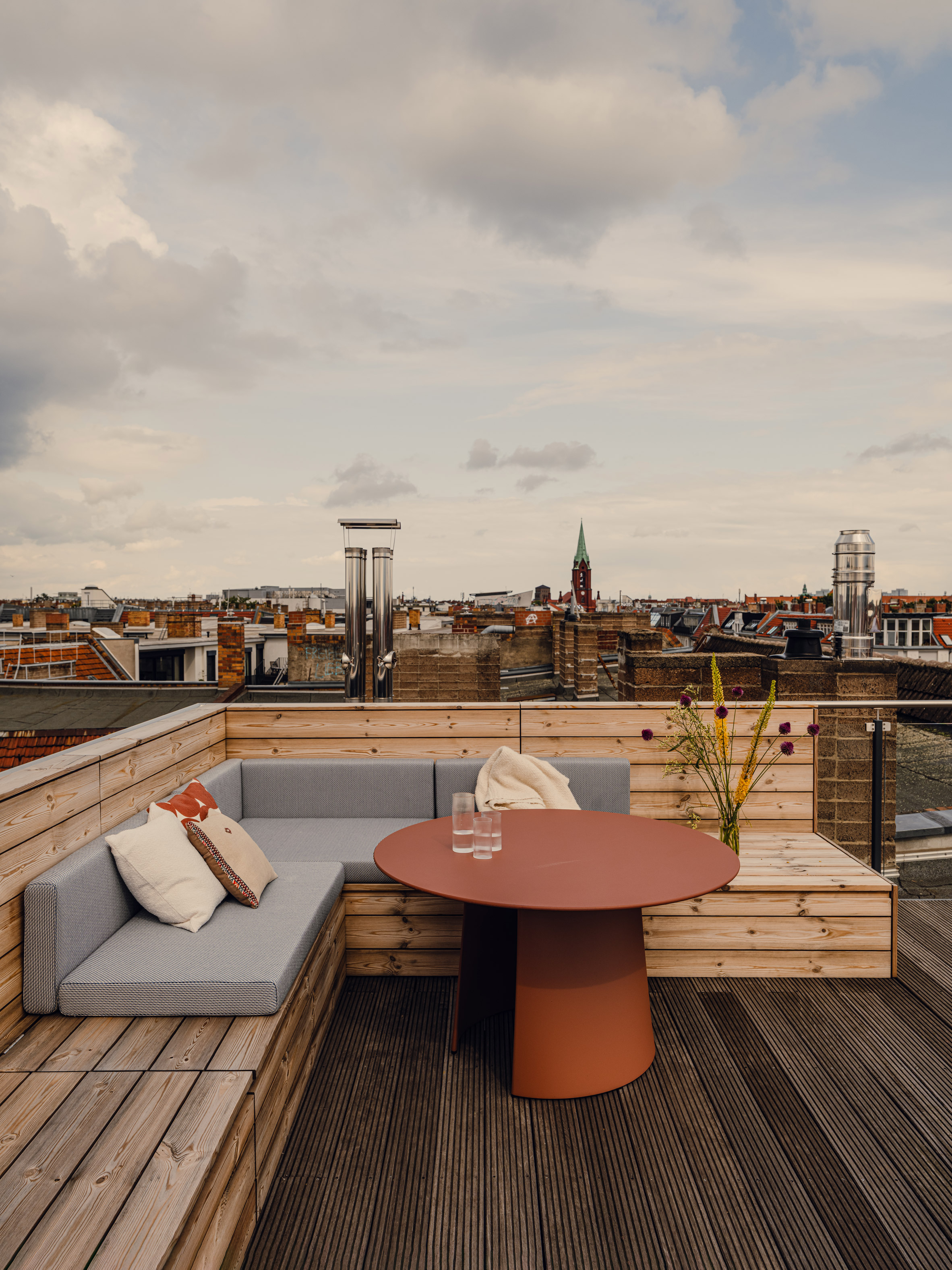 Outdoor terrace with built-in wooden benches