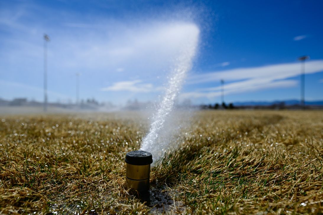 Sprinklers water athletics fields at Sandstone Ranch Community Park in Longmont on March 17.