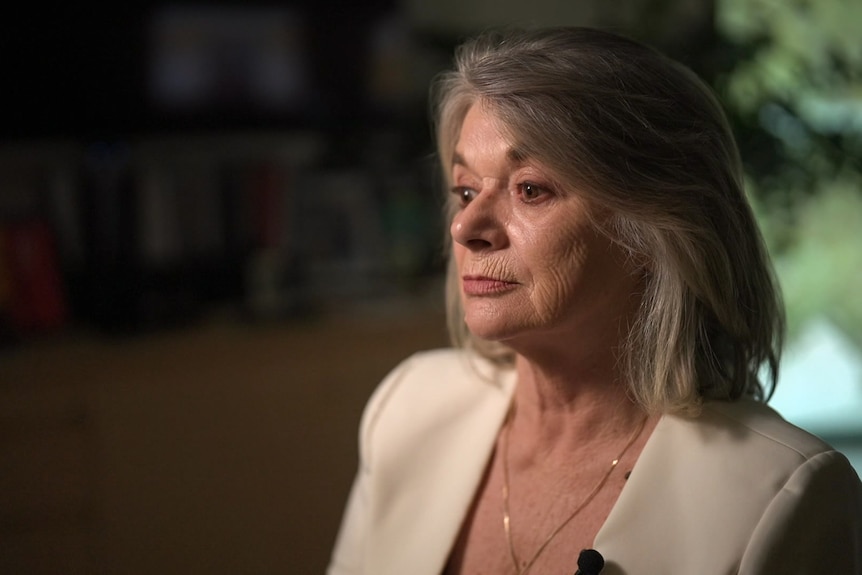 A woman wearing a suit.