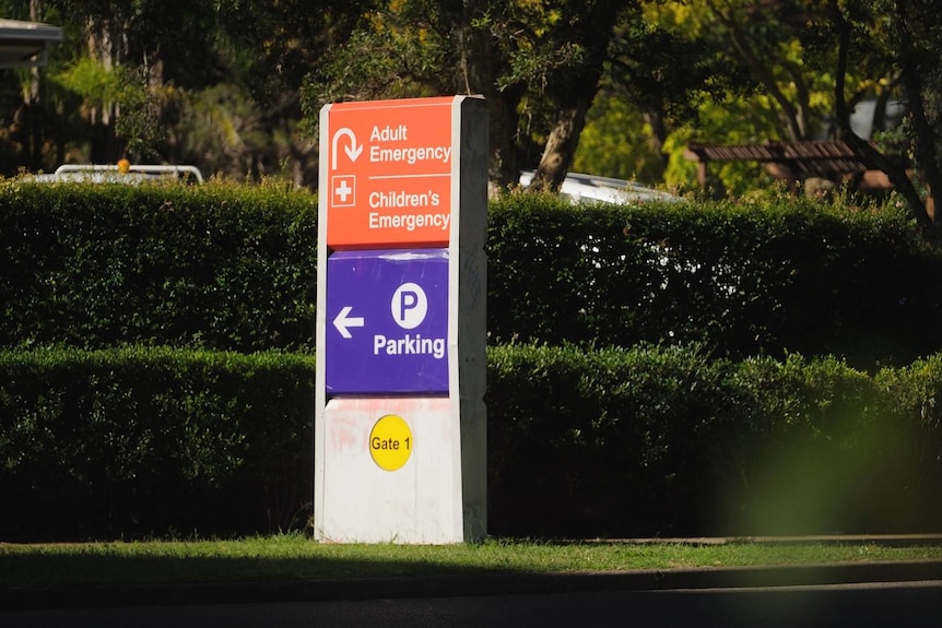 a street sign outside Randwick's Prince of Wales Hospital directing people to parking areas and emergency entrances