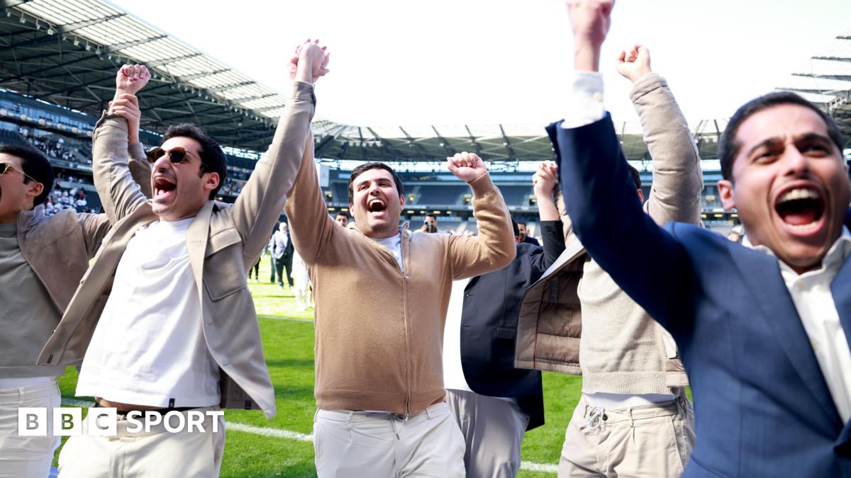 Milton Keynes Dons' owners celebrate their side's promotion to League One