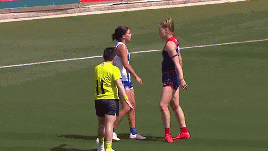 Melbourne’s Eden Zanker taunts former Demons teammate Libby Birch, now at North Melbourne, in the 2025 AFLW preliminary final.