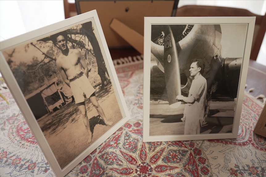 Two sepia photographs of a young man, framed and sitting on a table inside a home.