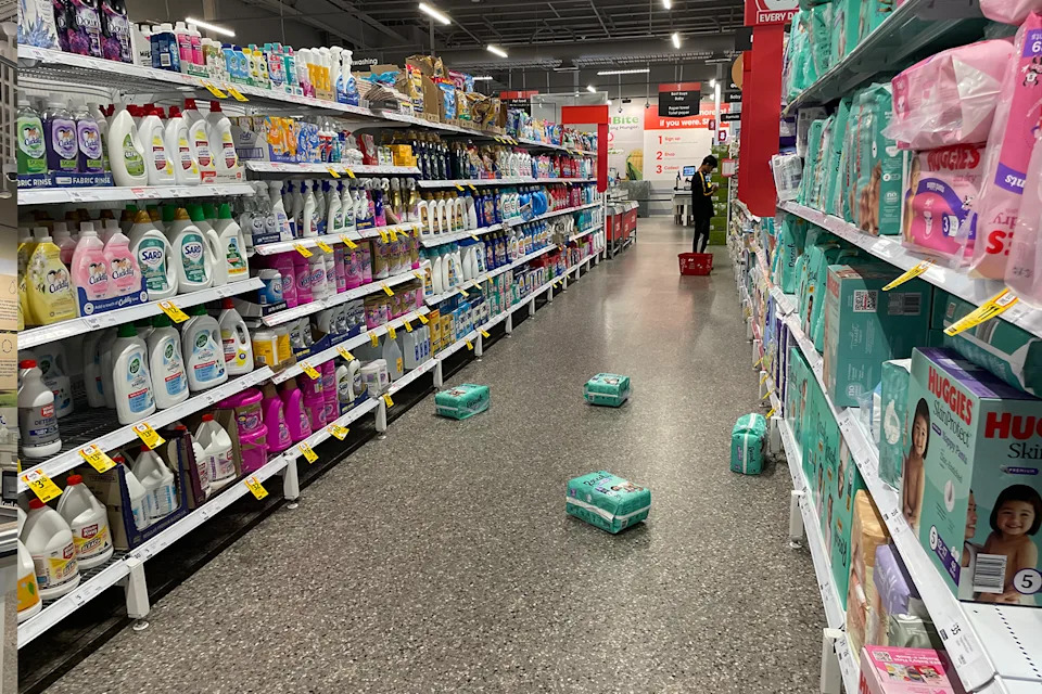 Nappies on the ground in a Coles aisle.