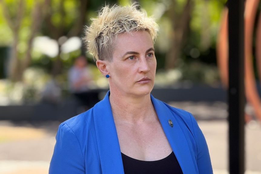A woman with short spikey blond hair 
