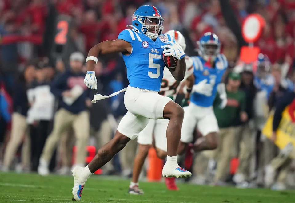Ole Miss Rebels running back Kewan Lacy (5) scores on a 73-yard touchdown run against the Miami Hurricanes during their Vrbo Fiesta Bowl matchup at State Farm Stadium on Jan. 8, 2026.
