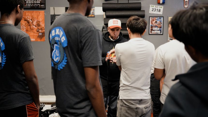 Mike Figueroa instructs boys in the boxing program at ATLAS High School.