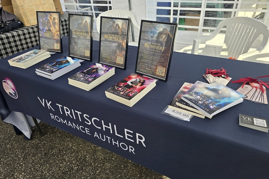 A display of books on a table at a book festival.