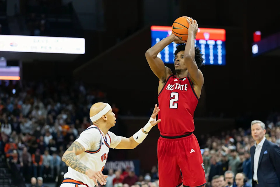 CHARLOTTESVILLE, VIRGINIA - FEBRUARY 24: Paul McNeil, Jr. #2 of the NC State Wolfpack shoots over Jacari White #6 of the Virginia Cavaliers in the first half during a game at John Paul Jones Arena on February 24, 2026 in Charlottesville, Virginia. (Photo by Ryan M. Kelly/Getty Images)