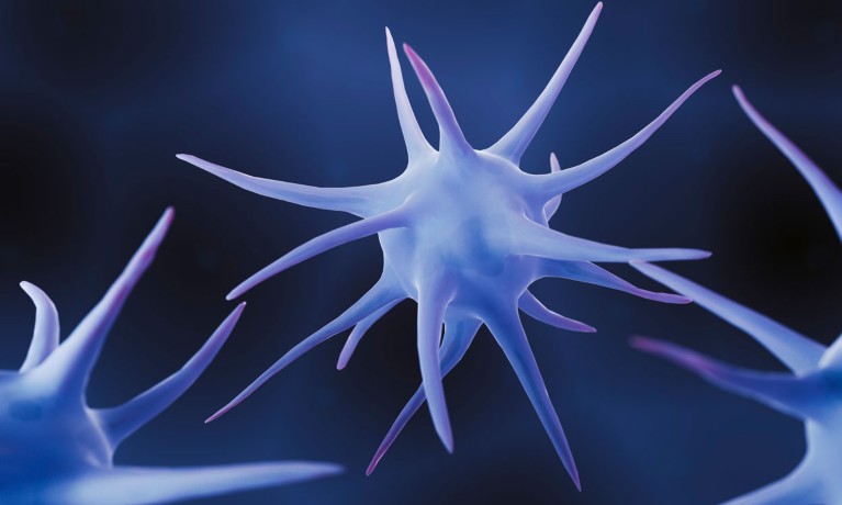 An illustration of spiky, blue‑purple dendritic cells on a dark blue background