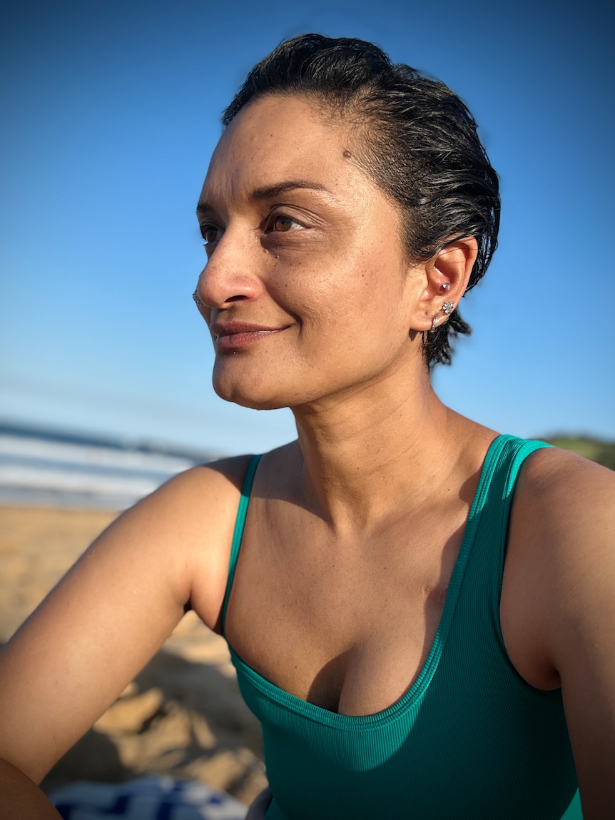 Aarthi in her swimmers at the beach