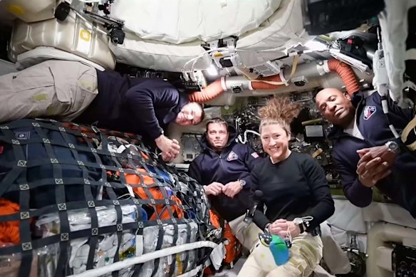 The Artemis II crew, from left, Canadian astronaut and mission specialist Jeremy Hansen, Commander Reid Wiseman, mission specialist Christina Koch and pilot Victor Glover on a video conference from the moon’s orbit.