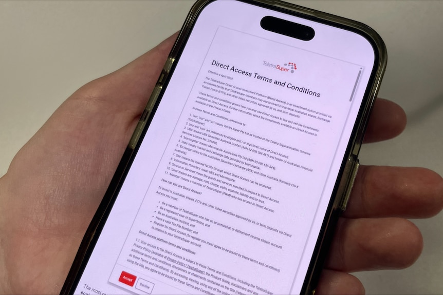 A hand holds a smartphone displaying a TelstraSuper terms and conditions document.