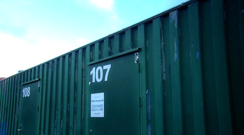 Emmerdale, storage unit 107 storage container with a door marked 107 and a rental sign