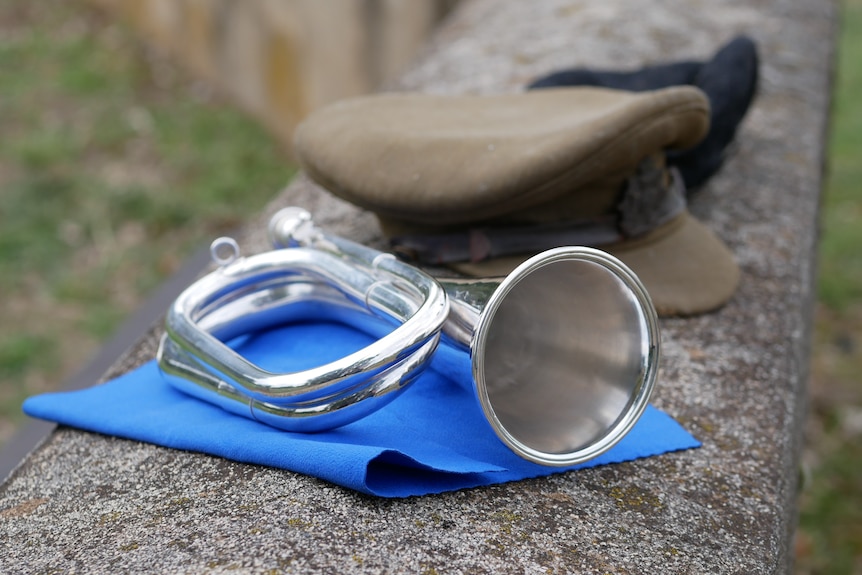  with worn military-style hats behind it. 