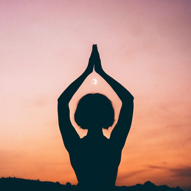 Silhouette of a Person Meditating with Crescent Moon at Sunset Silhouette of a Person Meditating with Crescent Moon at Sunset