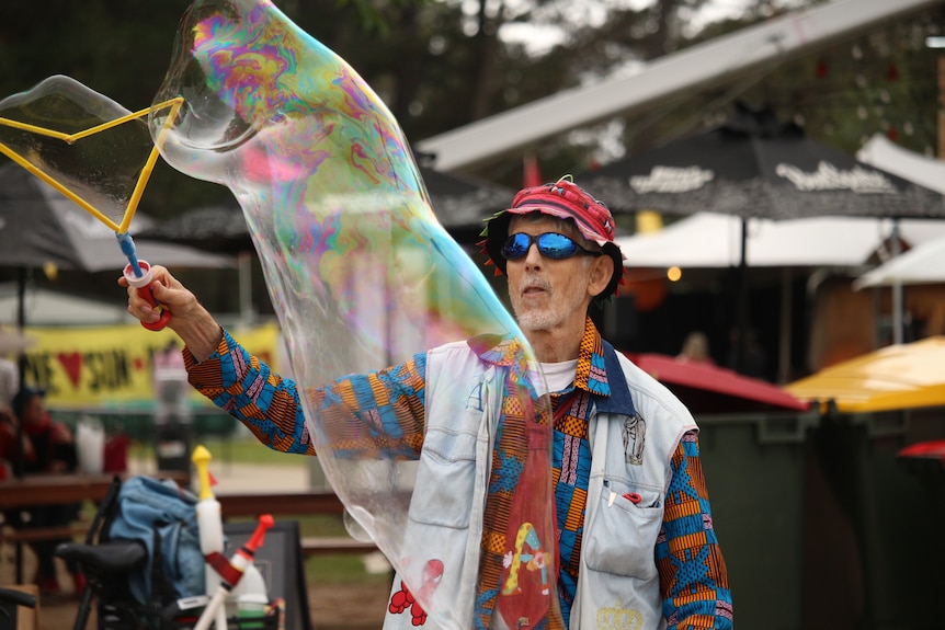 A man making a giant bubble.