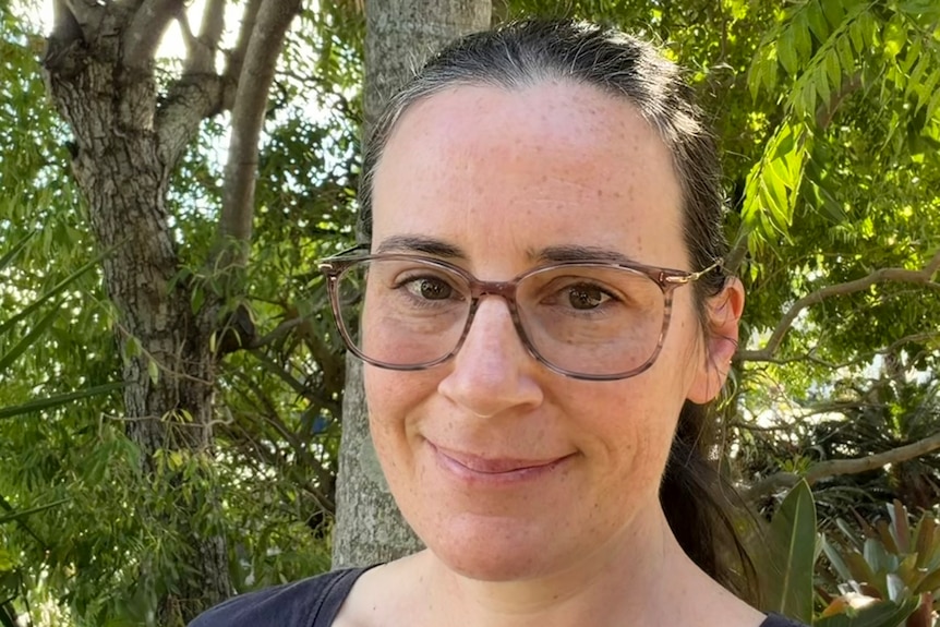 a portrait of a woman with glasses