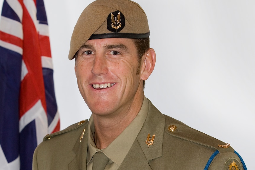 a special australian service soldier wearing crosses on his uniform