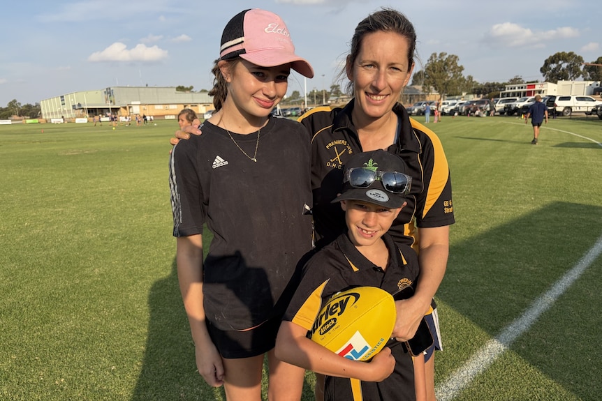 Isla, Louise and Rory Hagboom at the footy ground in Dowerin