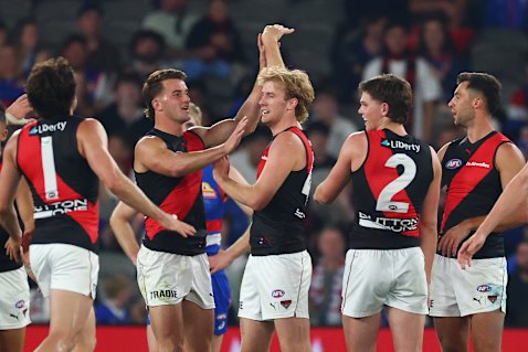 Tom Edwards (middle) was part of the Bombers’ second-half fightback in his first AFL game back from an ACL rupture.