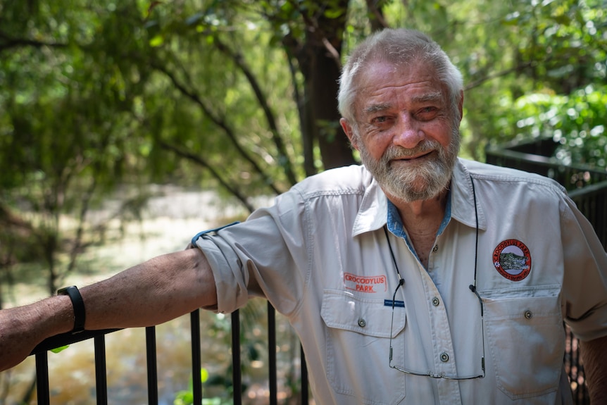 Grahame Webb smiles while standing in front of a river.