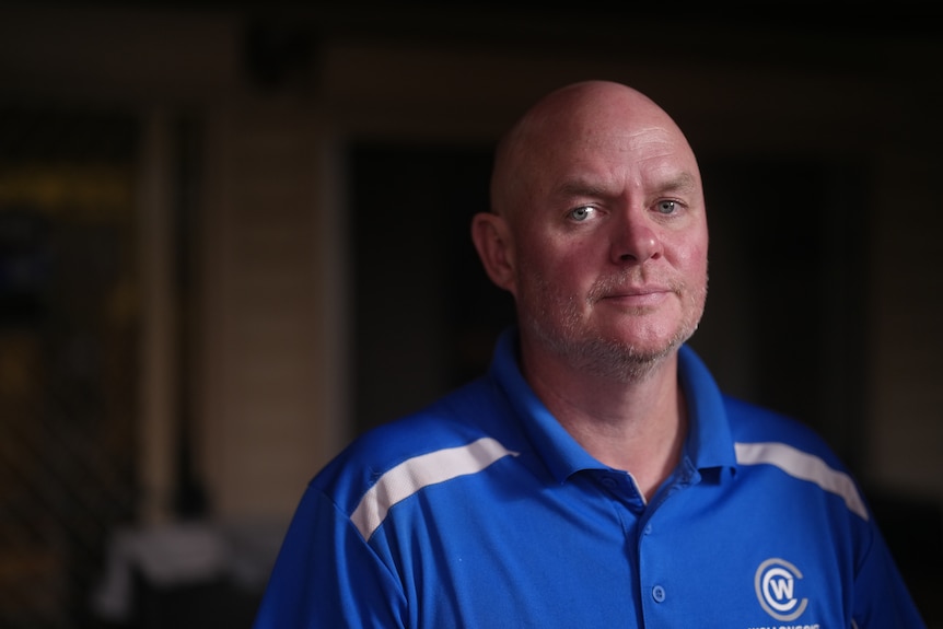 Man wearing a blue shirt.