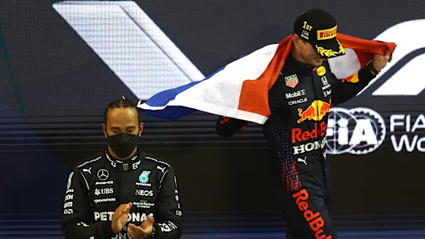 Race winner and 2021 F1 Drivers Champion Max Verstappen celebrates on the podium.
