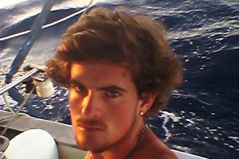 A man sitting on a boat