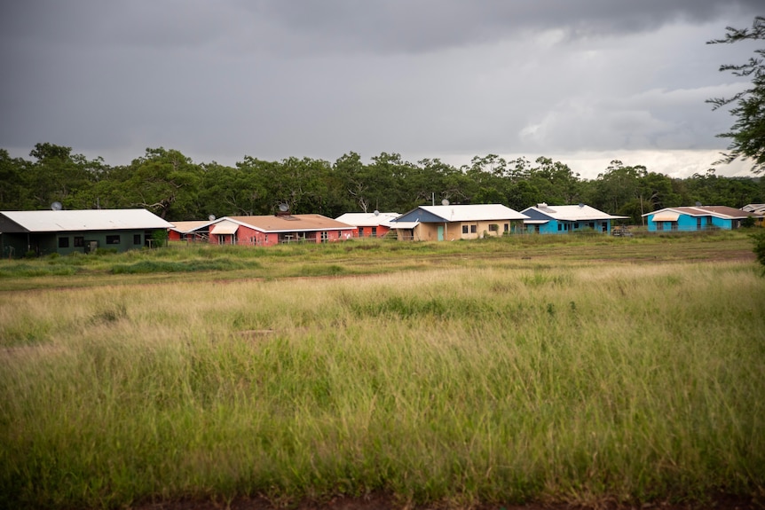 Colourful homes behind a field in Wadeye. 