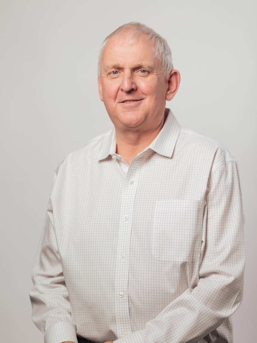 Alistair Parker wearing a white shirt