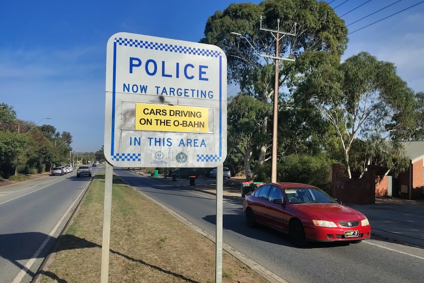 A police sign with a sign saying they are targeting cars driving on the O-Bahn