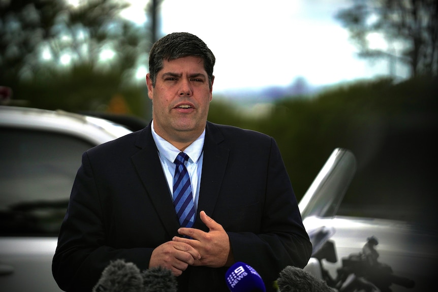 Transport Minister Brent Mickelberg speaking at a press conference