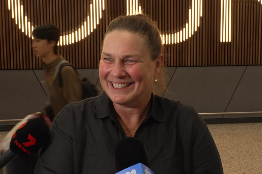 A smiling woman filled with royal pride.