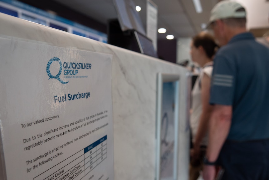 A sign informs boat passengers of a fuel surcharge.