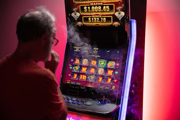 A player tests Walshe’s poker machine, with a losing sound on bets that don’t win.