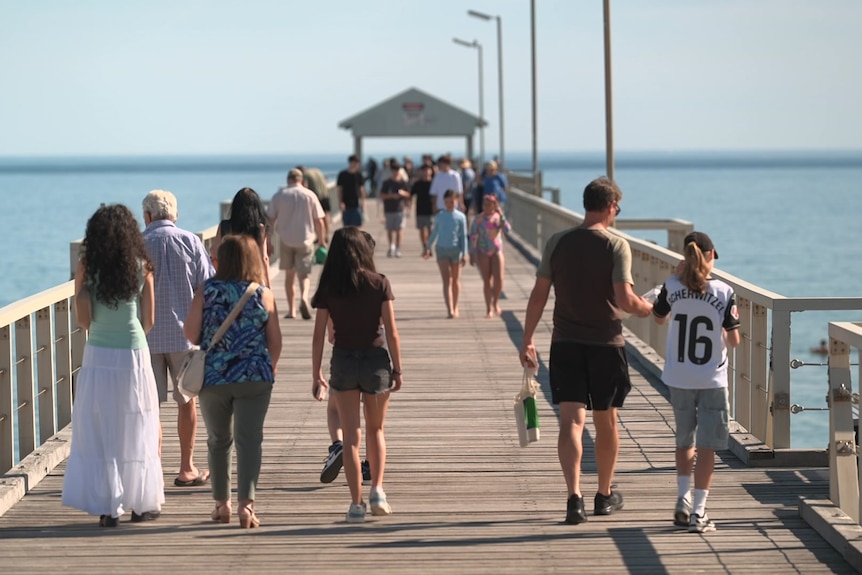 People walking on a jetty