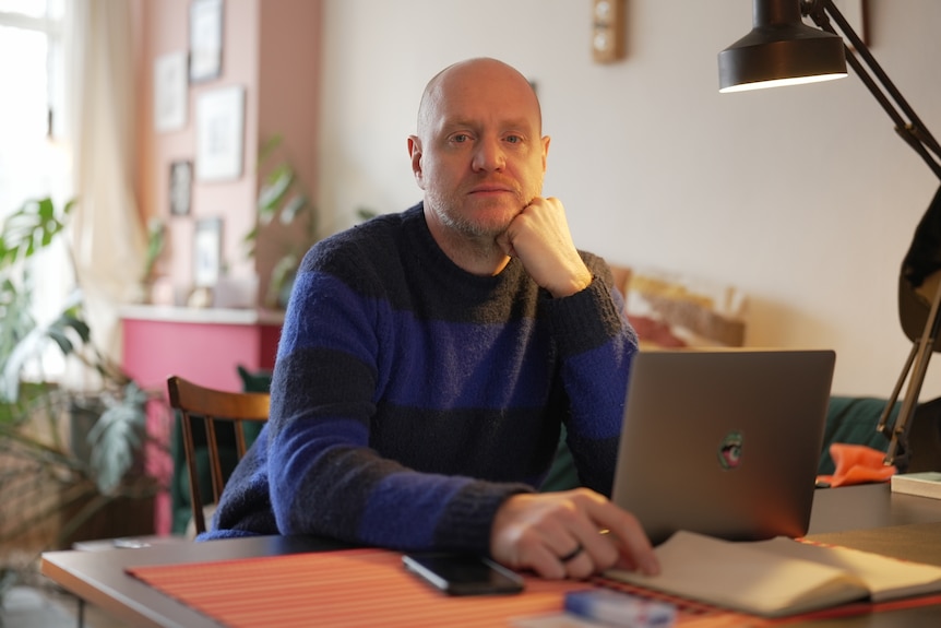 A man at his computer.