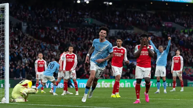 Nico O'Reilly scores for Manchester against Arsenal at Wembley in the Carabao Cup final