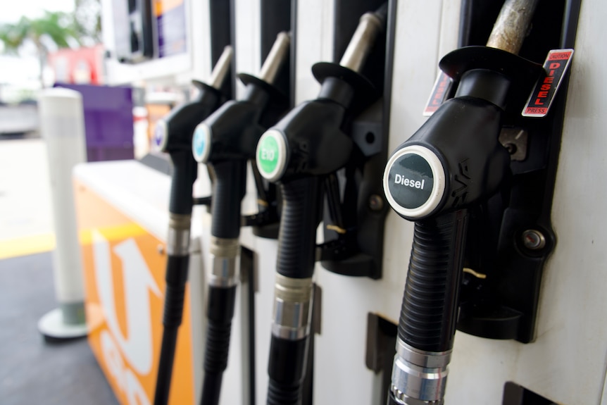 Close up of petrol pumps at a BP petrol station.