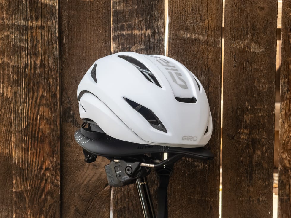 Bicycle helmet resting on a wooden surface. Bicycle helmet resting on a wooden surface.