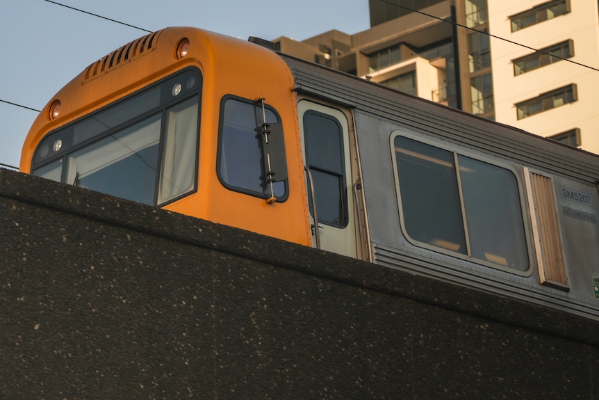 Queensland Rail suburban train crossing the Merivale Bridge in Brisbane.