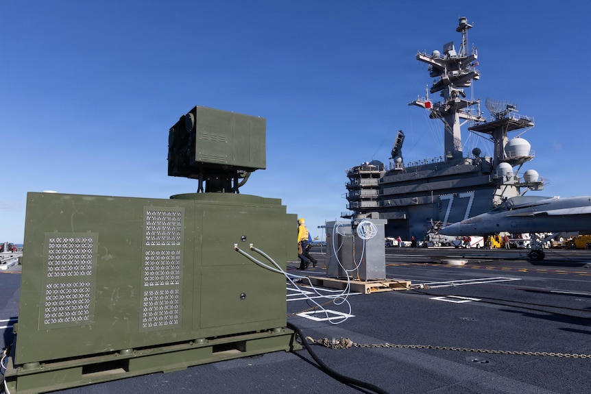 A large box on the deck of a warship.
