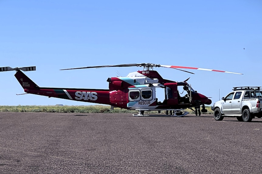 A SAAS helicopter on tarmac.