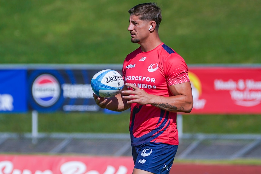 Zac Lomax warming up for the Western Force before their match against Fijian Drua.