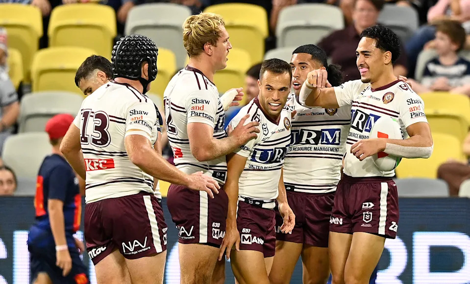Seen here, Manly Sea Eagles players celebrate during their win over North Queensland.